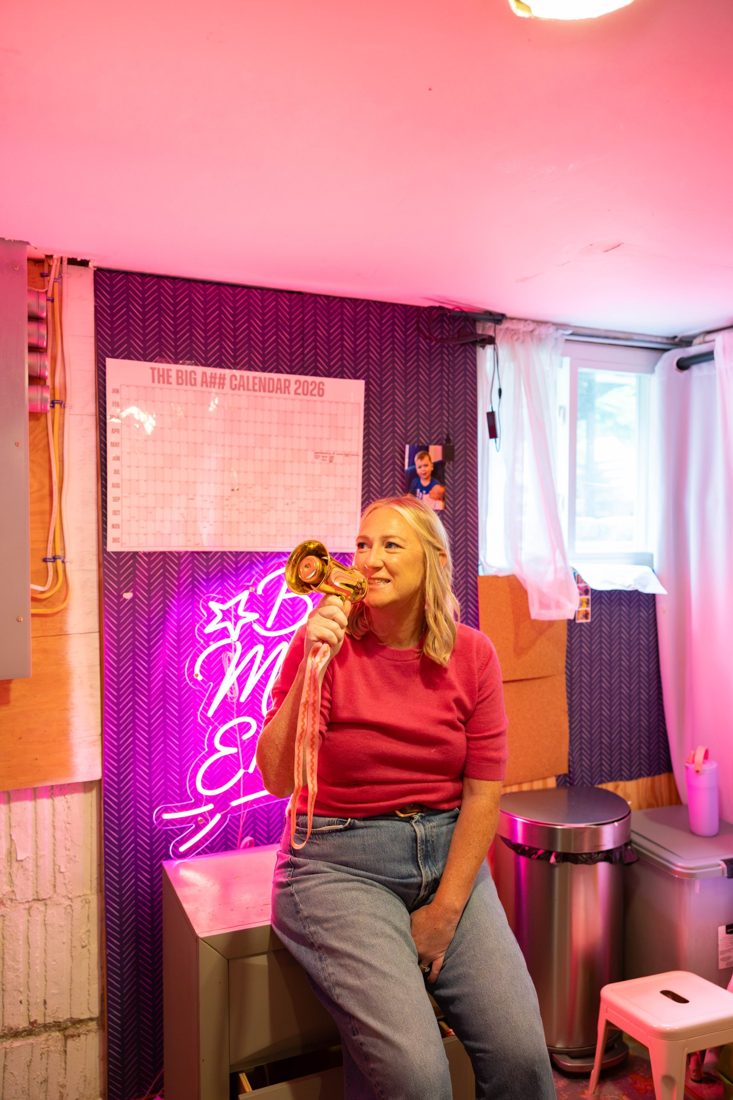Megan Darrell holding a megaphone at Big Mother Energy HQ